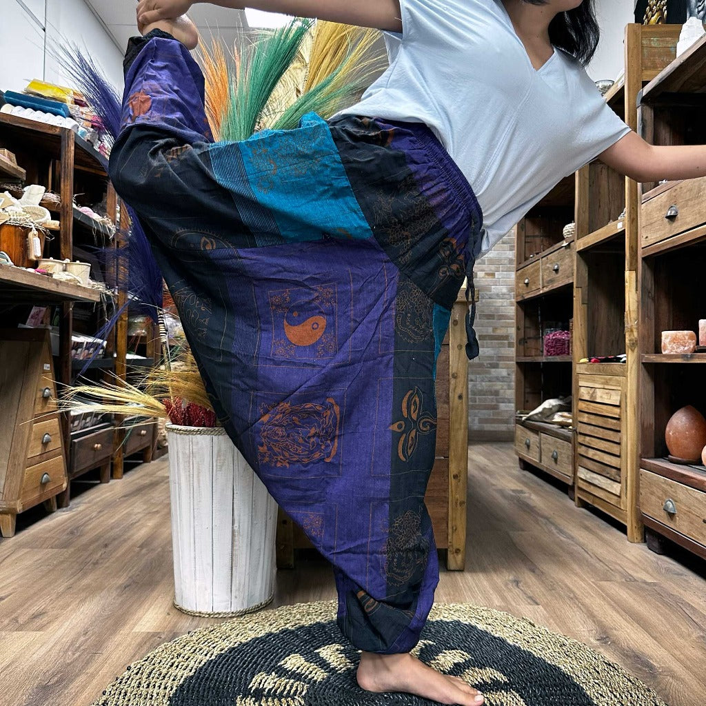 Cotton Yoga Trousers Comfy Festival Pants - Colourful Himalayan prints.a full range of Yoga and Festival Pants for you, all made from 100% cotton. These pants are made in Nepal and are super soft, lightweight, and stylish. They come in one size that fits everyone, making them a great choice for most people. Plus, we deliver these yoga and festival pants in a small cotton bag to add a special touch. The collection features three styles: High Cross, Aladdin, and Fisherman