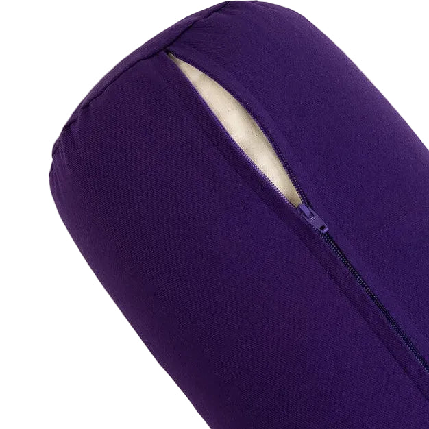 Purple yoga bolster on a light gray background