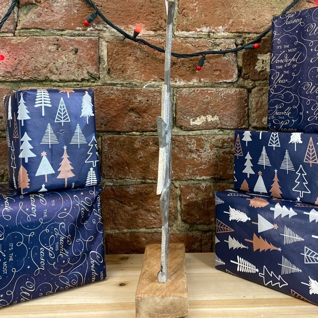 Emmy Jane Boutique - Christmas Stars Decoration - Silver Metal Stars Wooden Base Ornament - 40cm. A metal stacking stars table or hearth decoration. An attractive festive piece suitable for any home. Set on a wooden plinth measuring 15x5.5cm
