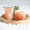 This tulip-shaped Himalayan salt oil burner pairs beautifully with the salt's natural variations of pink hues. Place a tealight inside and your choice of fragrance oil or wax melts on the glass dish to fill the home with fragrance.