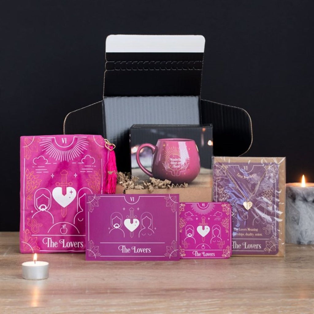 Emmy Jane Boutique - Romantic Gifts For The One You Love - The Lovers Tarot Gift Set This new Lovers Tarot Gift Set comes beautifully presented in a recyclable, black-lined box with eco-friendly shredded paper filling. Arrives ready to gift for birthdays, Valentine's Day, anniversaries, or special pick-me-ups with an added insert card. The Gift set includes Lovers Tarot Card Coaster Lovers Tarot card Zipper Pouch Lovers Tarot Necklace Card Pink Fortune Teller Colour Changing Mug.