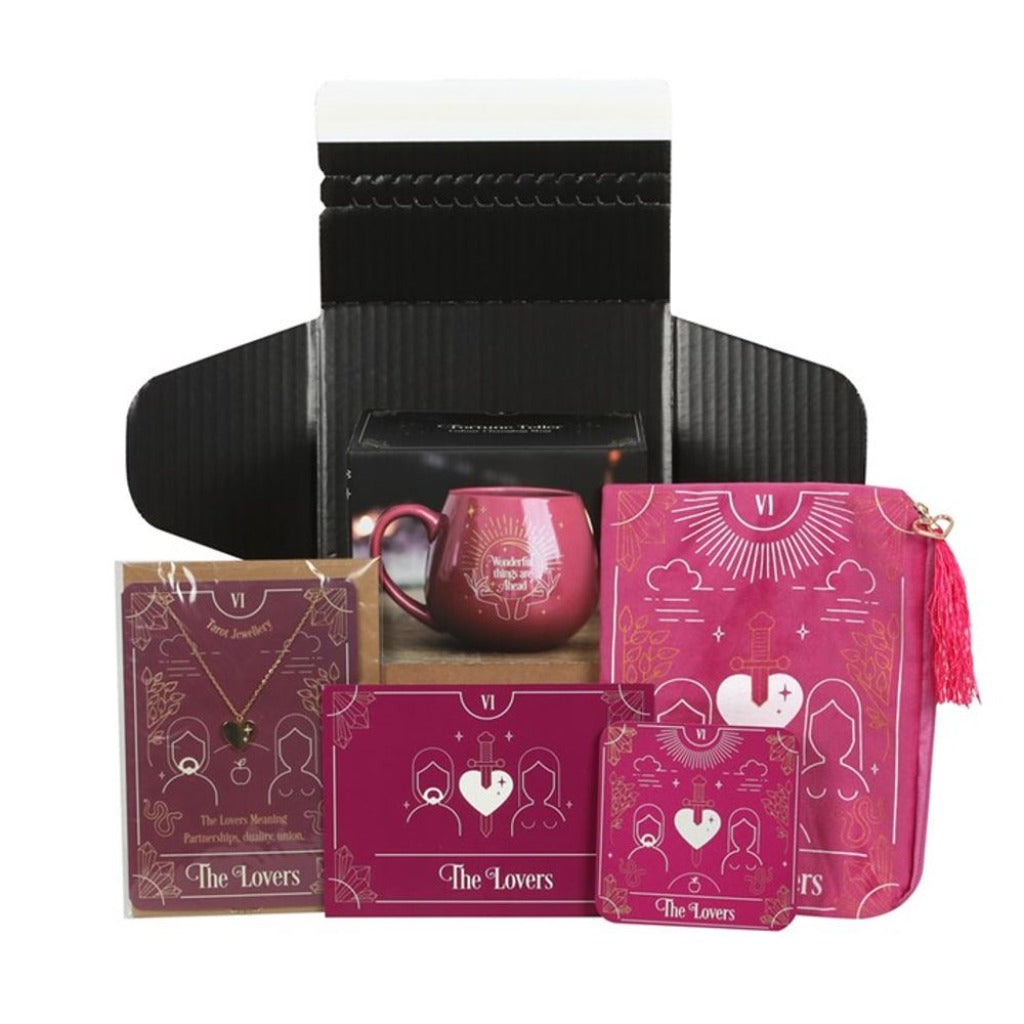 Emmy Jane Boutique - Romantic Gifts For The One You Love - The Lovers Tarot Gift Set This new Lovers Tarot Gift Set comes beautifully presented in a recyclable, black-lined box with eco-friendly shredded paper filling. Arrives ready to gift for birthdays, Valentine's Day, anniversaries, or special pick-me-ups with an added insert card. The Gift set includes Lovers Tarot Card Coaster Lovers Tarot card Zipper Pouch Lovers Tarot Necklace Card Pink Fortune Teller Colour Changing Mug.