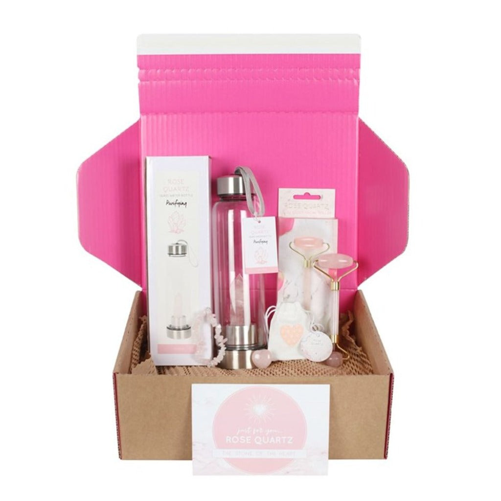 Emmy Jane Boutique - Rose Quartz Gift Set -  Birthdays Mother's Day Anniversaries & Valentines. This lovely gift set includes  1 x Rose Quartz Crystal Heart Stone, 1 x Rose Quartz Crystal Bracelet, 1 x Rose Quartz Face Roller and 1 x Rose Quartz Purifying Glass Water Bottle.
