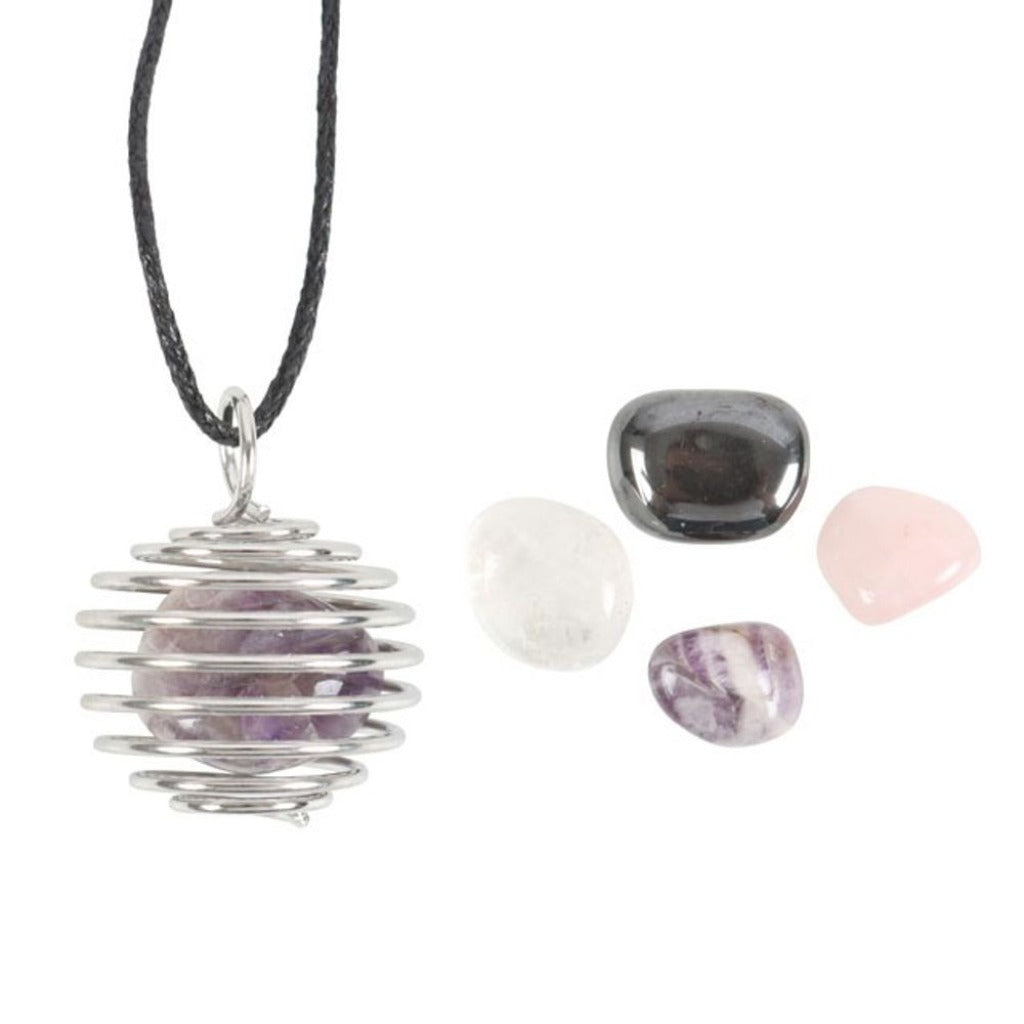 'Build your own' crystal necklace kit. Includes 4 tumble stones and a nickel-free spiral cage necklace for easily swapping out the stones. Crystals include amethyst rose quartz, clear quartz, and hematite presented in a matching gift box. 