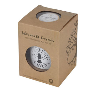 Wax Melts Gift Set - Soy Wax Sweet Cedar - Tree of Life Wax Warmer Gift Set. Fragrance the home with this elegant Tree of Life wax warmer gift set. A white ceramic burner is accented by a wood-effect base and a stunning Tree of Life cut-out design. The set includes a tin of eco soy wax melts in the scent 'Sweet Cedar' that exudes the feeling of forest walks and cabin getaways.