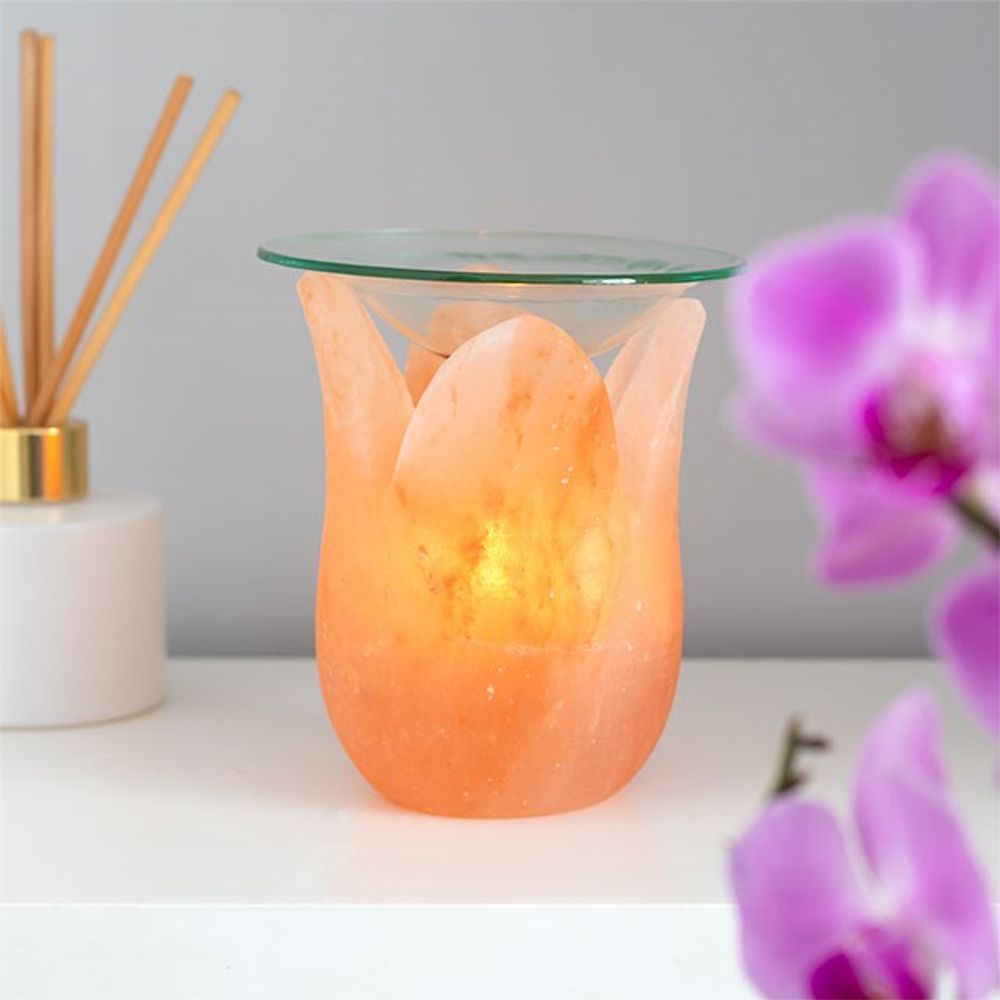 This tulip-shaped Himalayan salt oil burner pairs beautifully with the salt's natural variations of pink hues. Place a tealight inside and your choice of fragrance oil or wax melts on the glass dish to fill the home with fragrance.